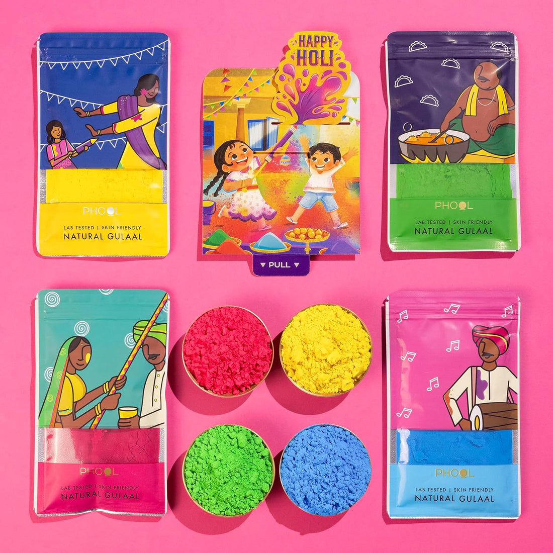 Colorful Holi gift set with traditional items on a pink background