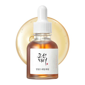 Skincare serum bottle with dropper on a white background