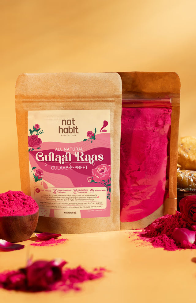 Package of 'nat habit' Gulalai Risps with pink gulal powder on a yellow background