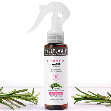 Soulflower Rosemary Water spray bottle with rosemary leaves on a white background