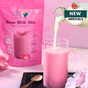 Rose Milk Mix being poured into a glass with a pink packaging in the background.