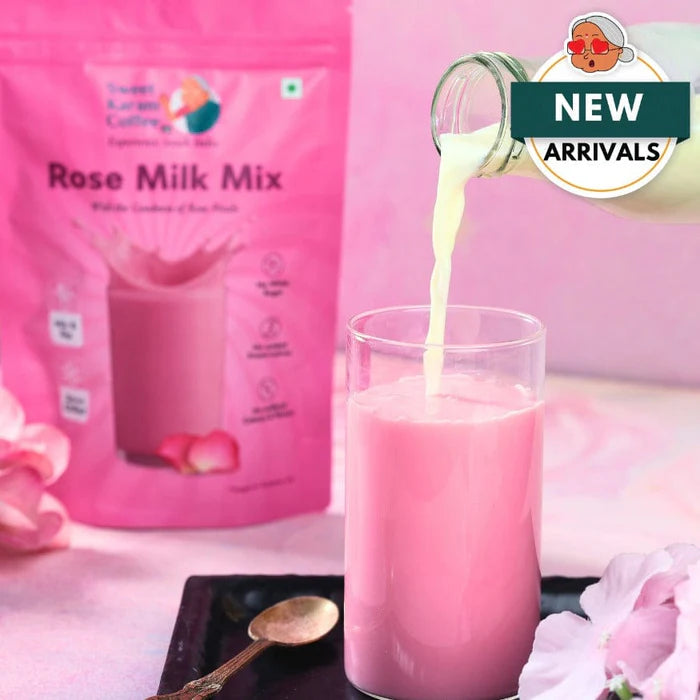 Rose Milk Mix being poured into a glass with a pink packaging in the background.