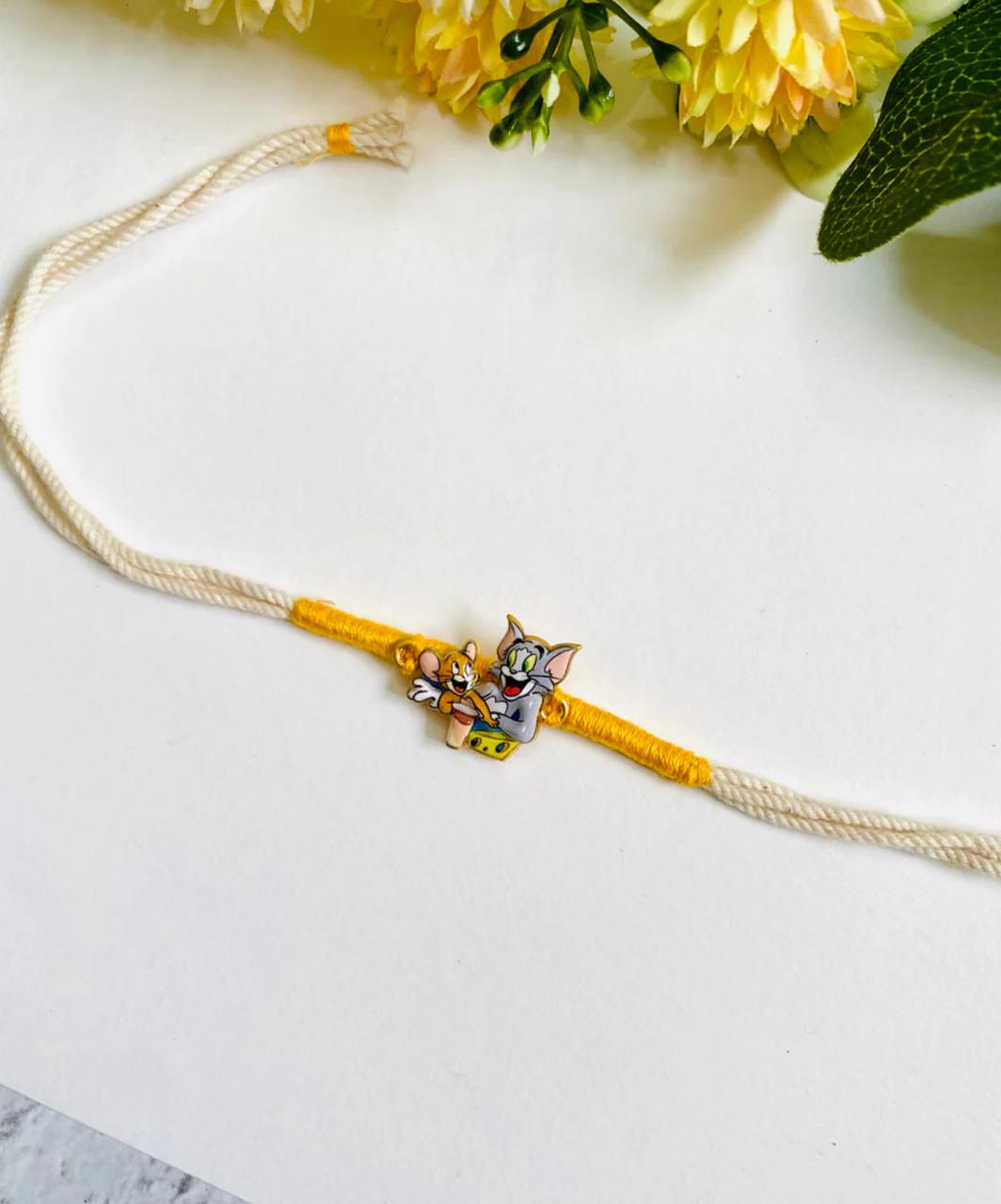 Rakhi Set of 2 [ Ganesh & Tom - Jerry]