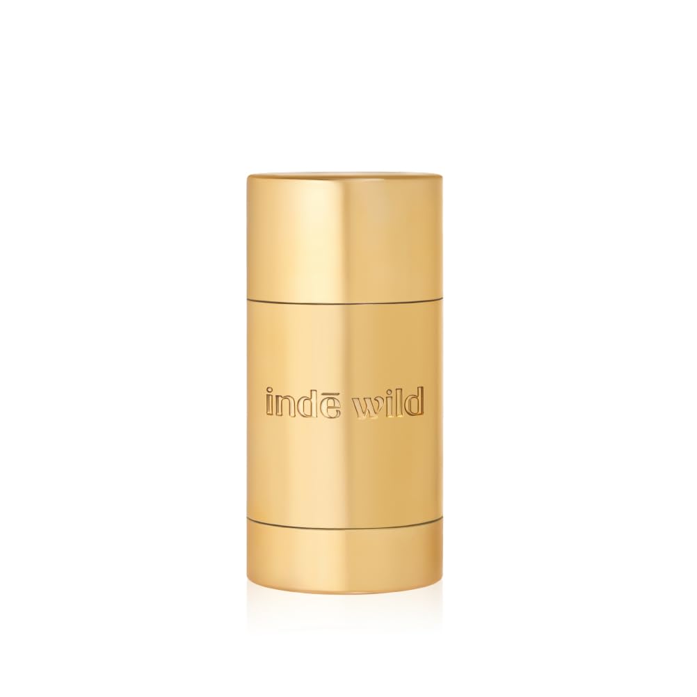Gold cylindrical container with 'inde wild' branding on a white background